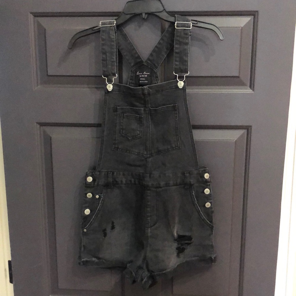 Small, black, distressed denim overalls